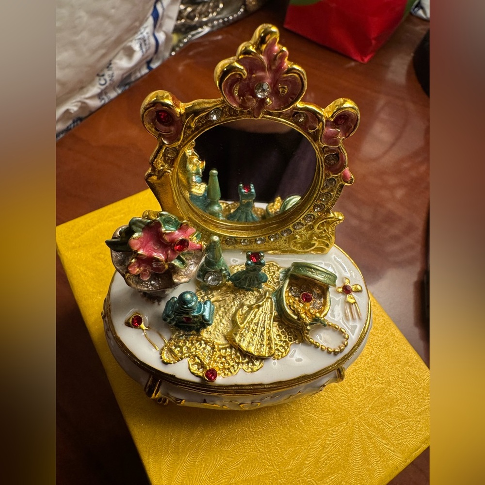 Radiant Gold and Sapphire Trinket Box with Intricate Detailing
